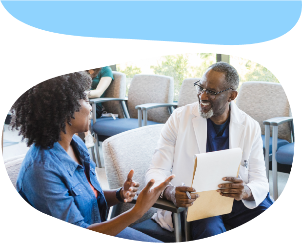 A doctor and an adult talking to each other