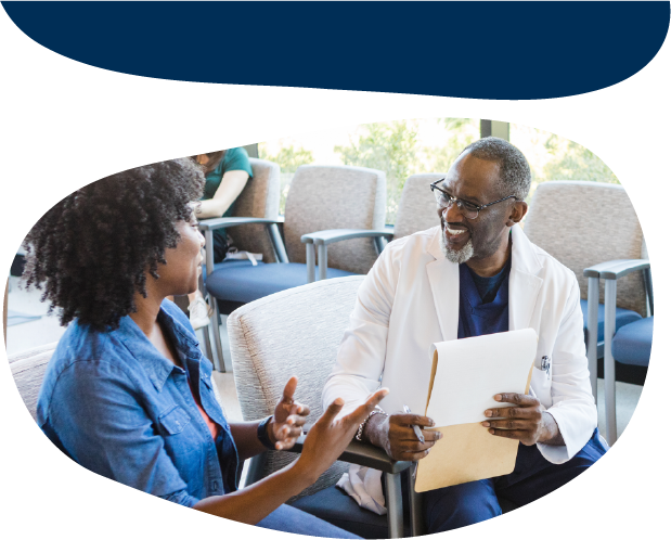 A doctor and an adult talking to each other