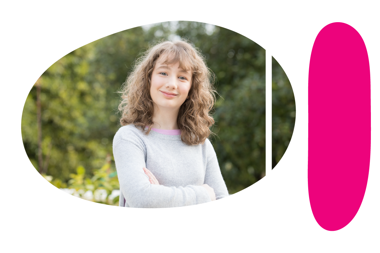 Teenager smiling with their arms crossed