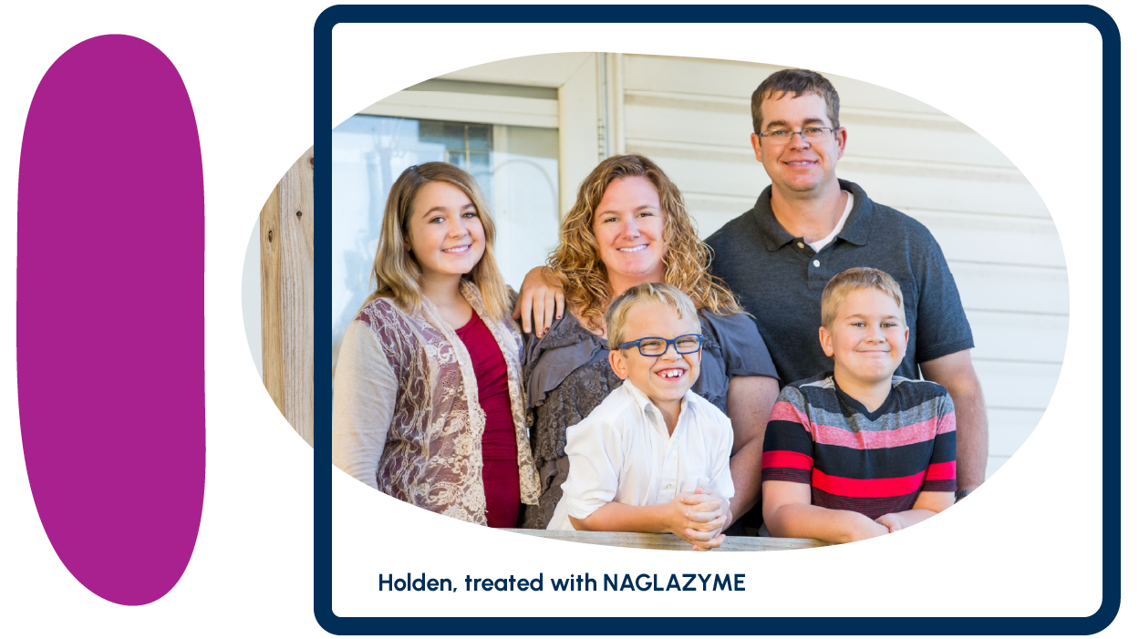 A family of five smiling