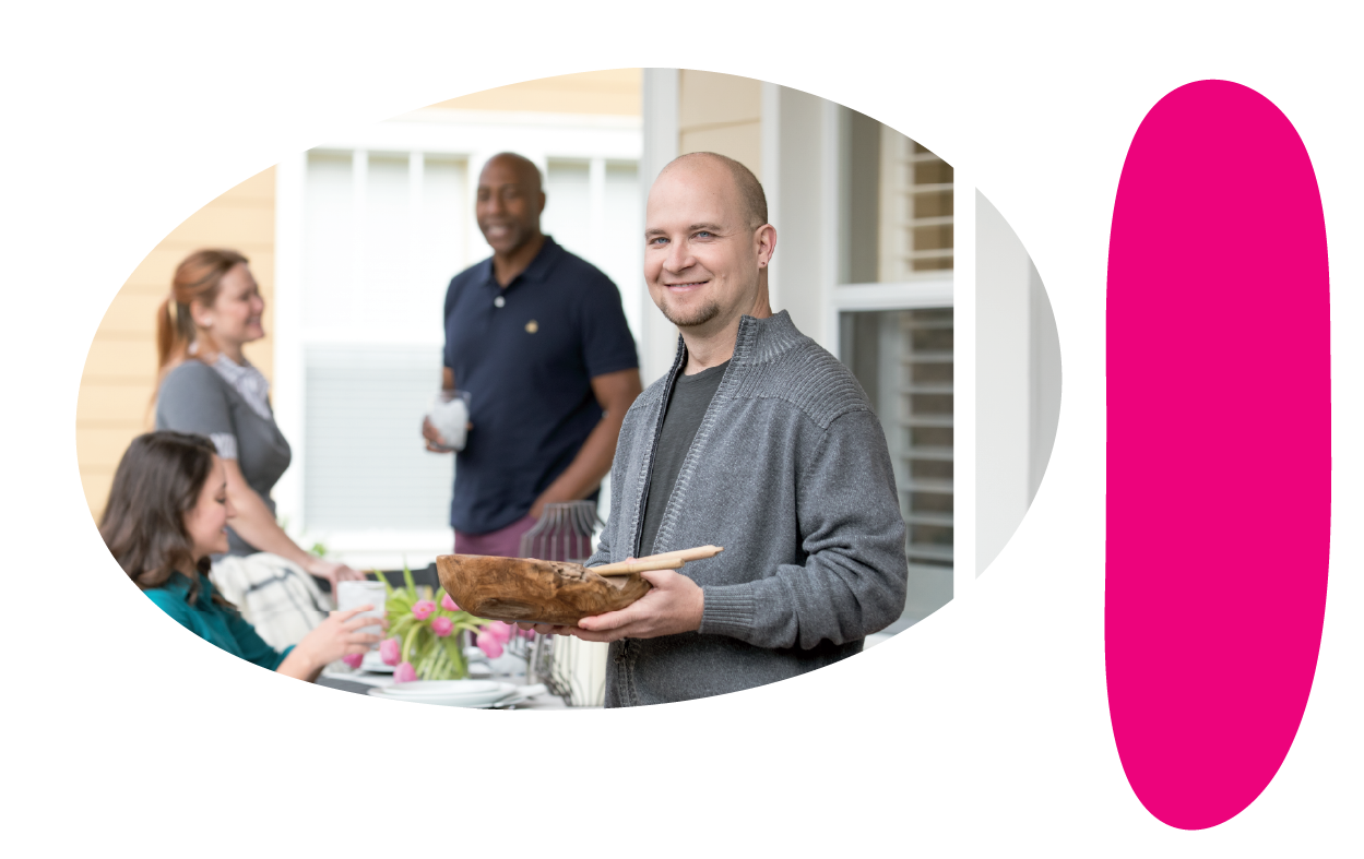 A group of four adult people talking and eating