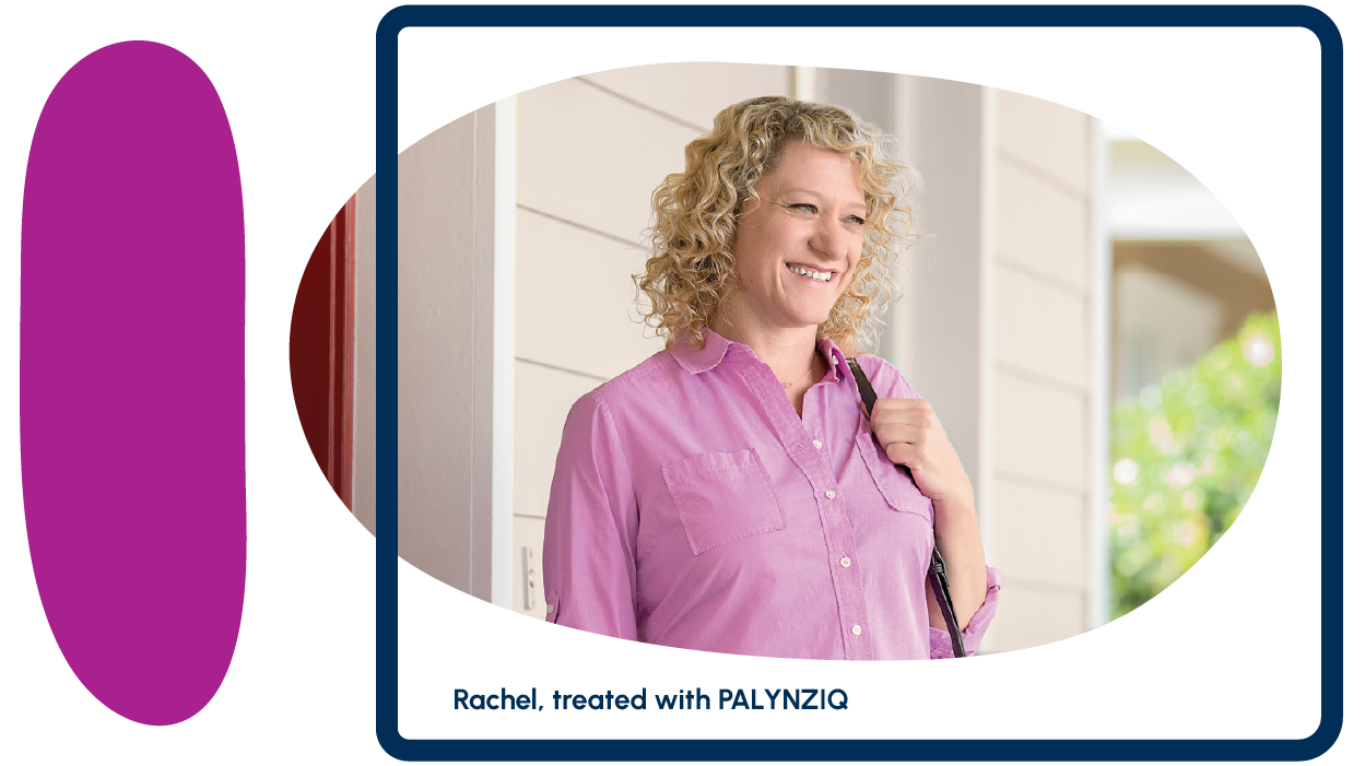 An adult person smiling outside a house